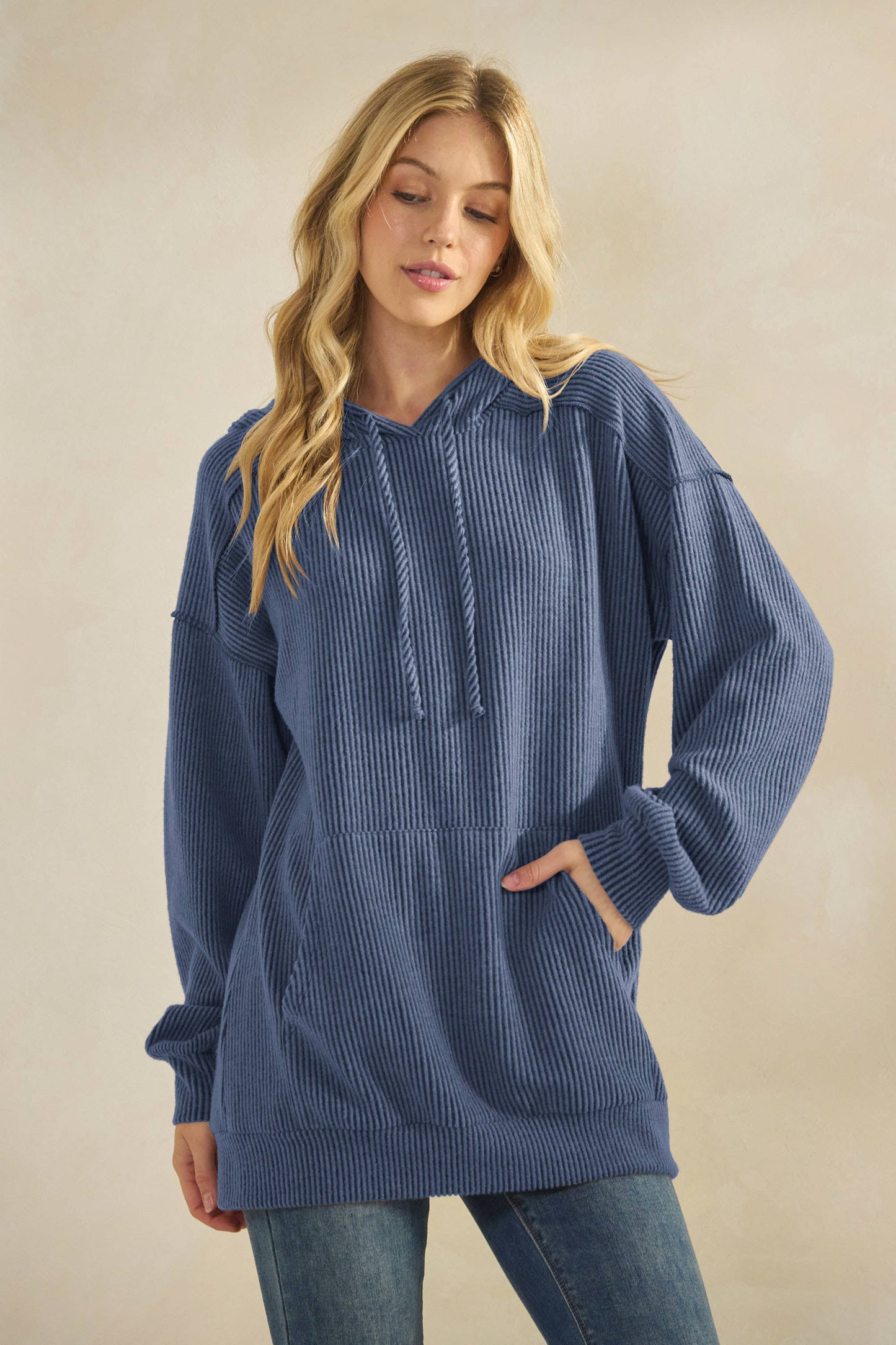 Girl wearing blue hoodie with pockets