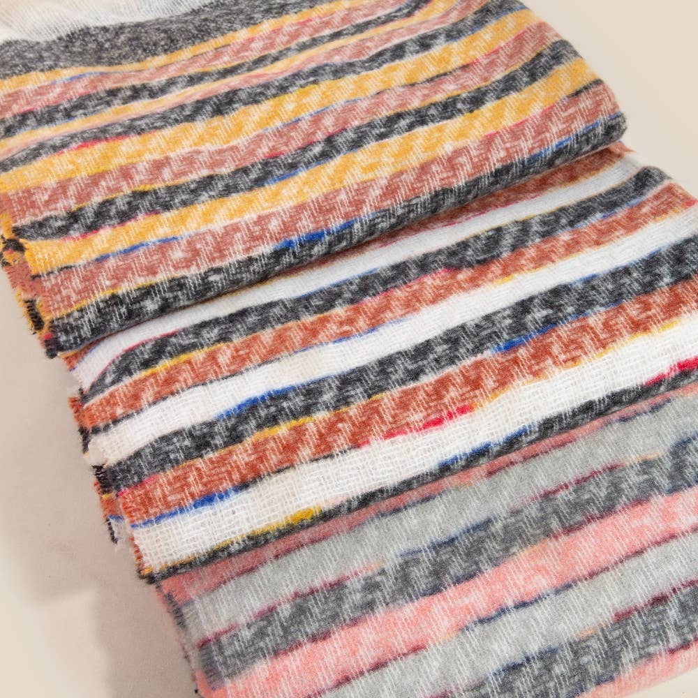 Stack of colorful striped fabric swatches on a light background