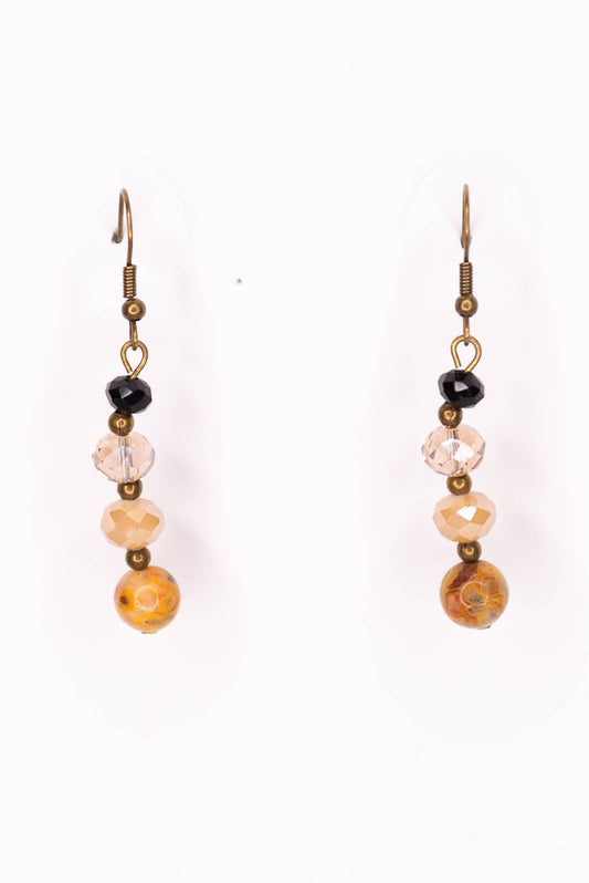 Pair of earrings with beads on a white background
