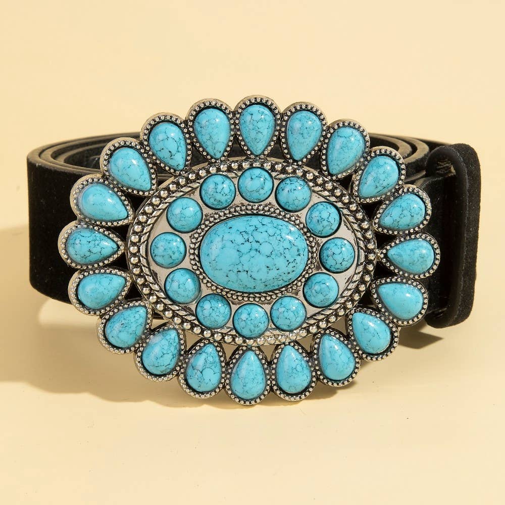 Belt with turquoise stone buckle on a beige background