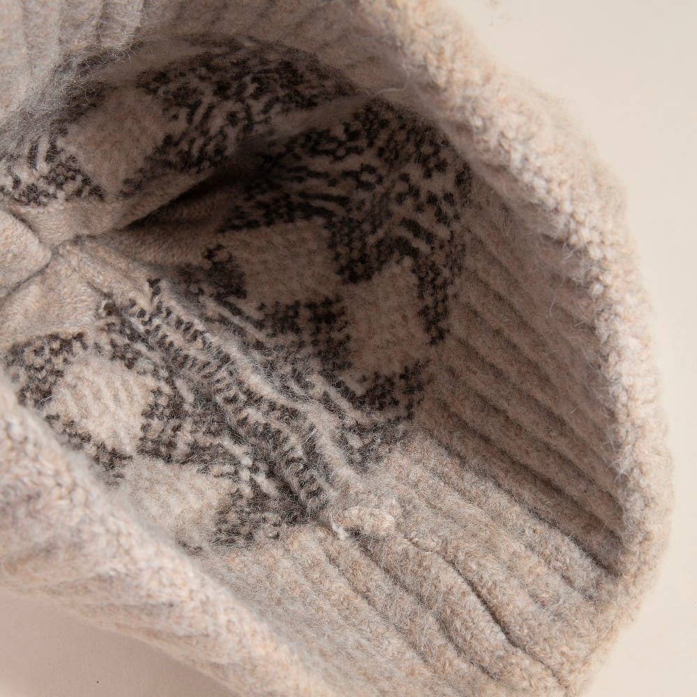 Close-up of a textured beige fabric with a pattern