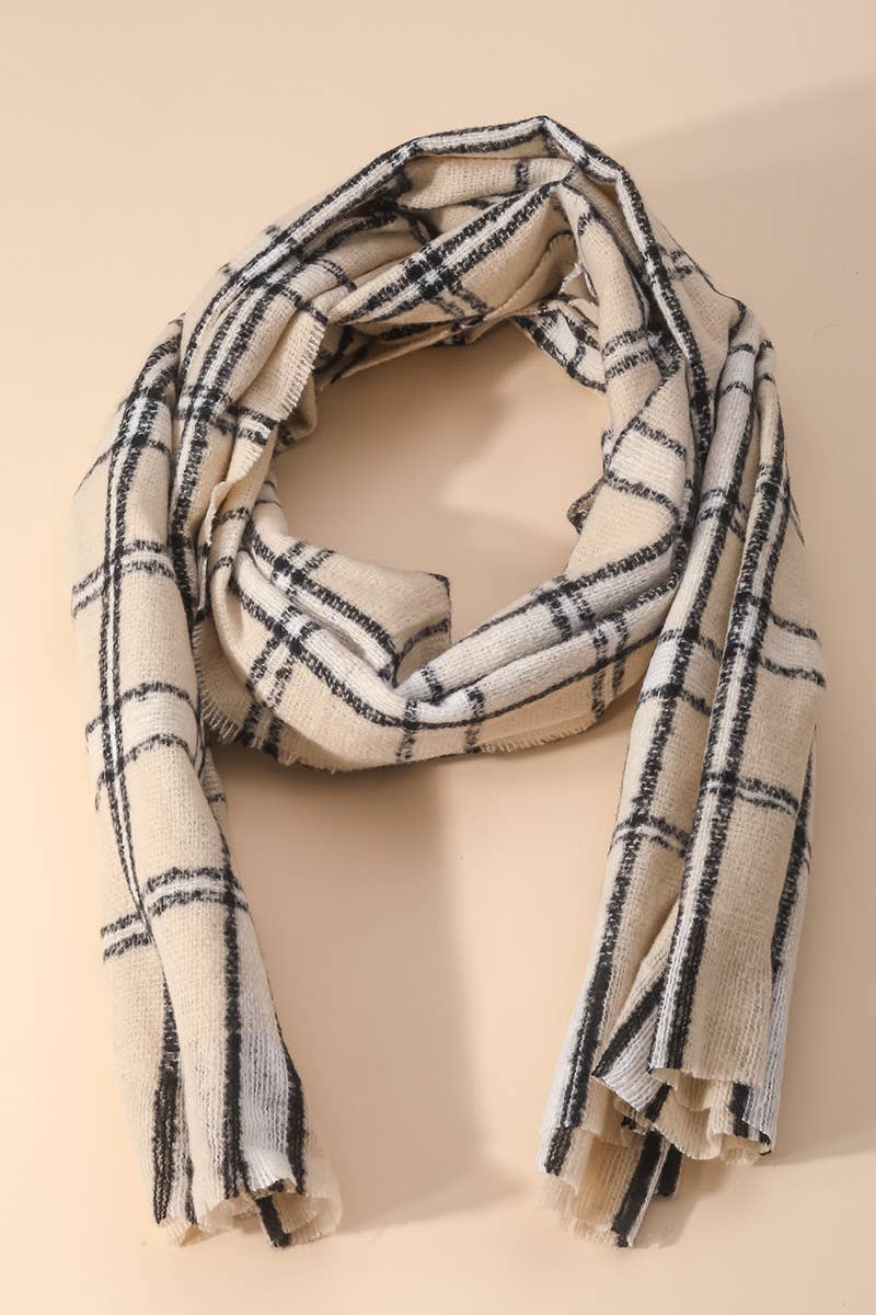 Plaid scarf with black and white pattern on a beige background