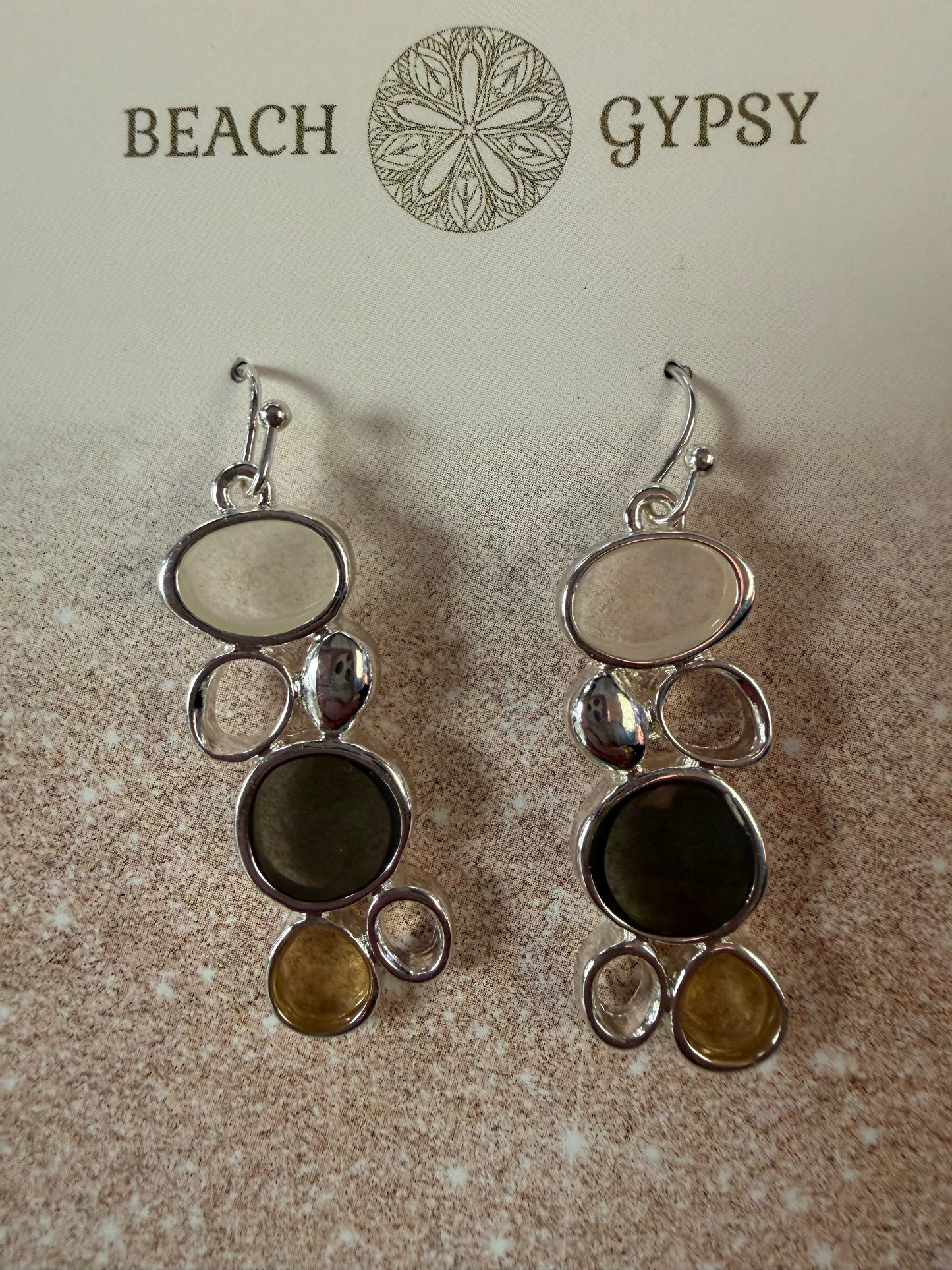 Brown sea glass dangle earrings on Beach Gypsy branded card