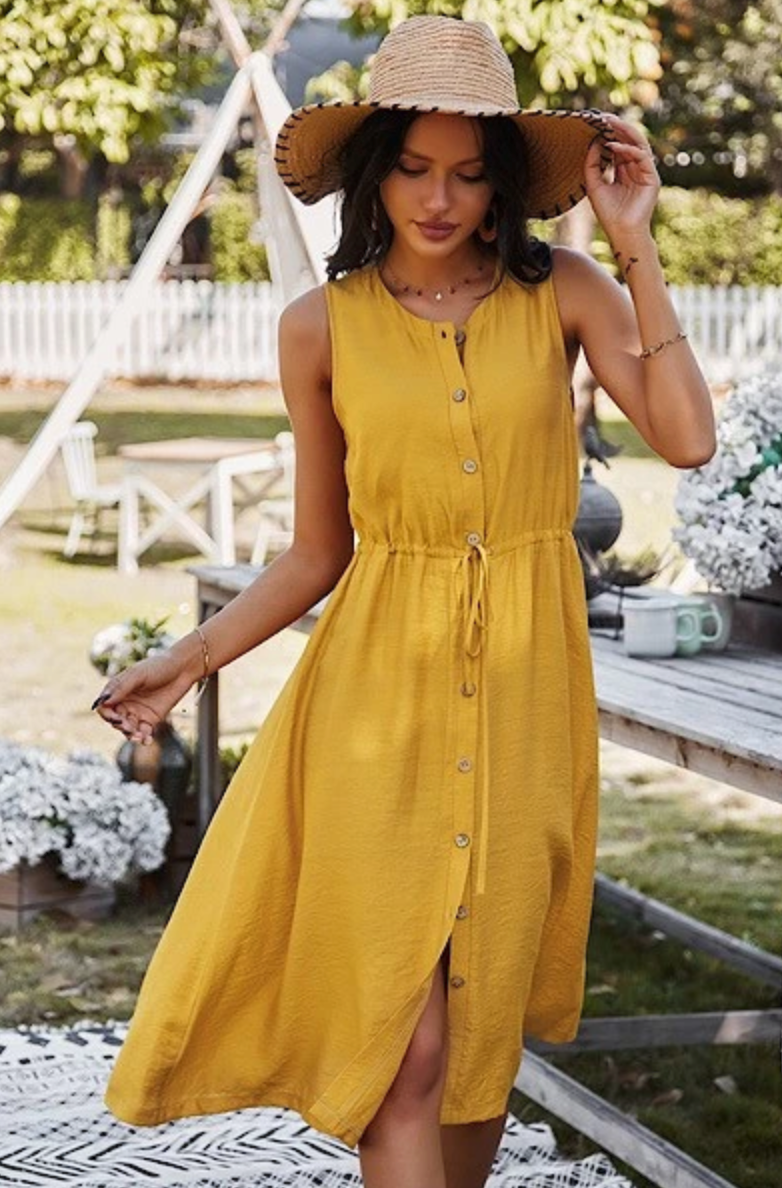 Woman in Yellow button down dress