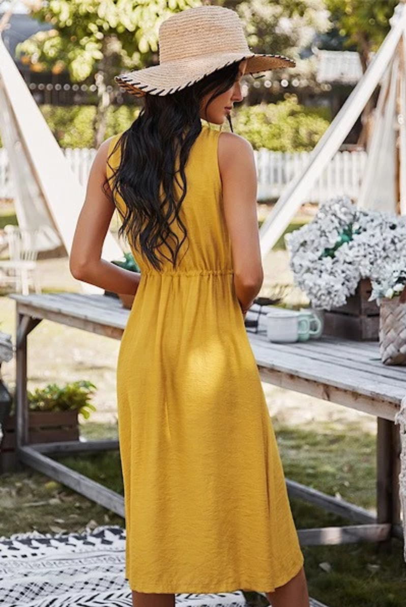 Woman in Yellow button down dress