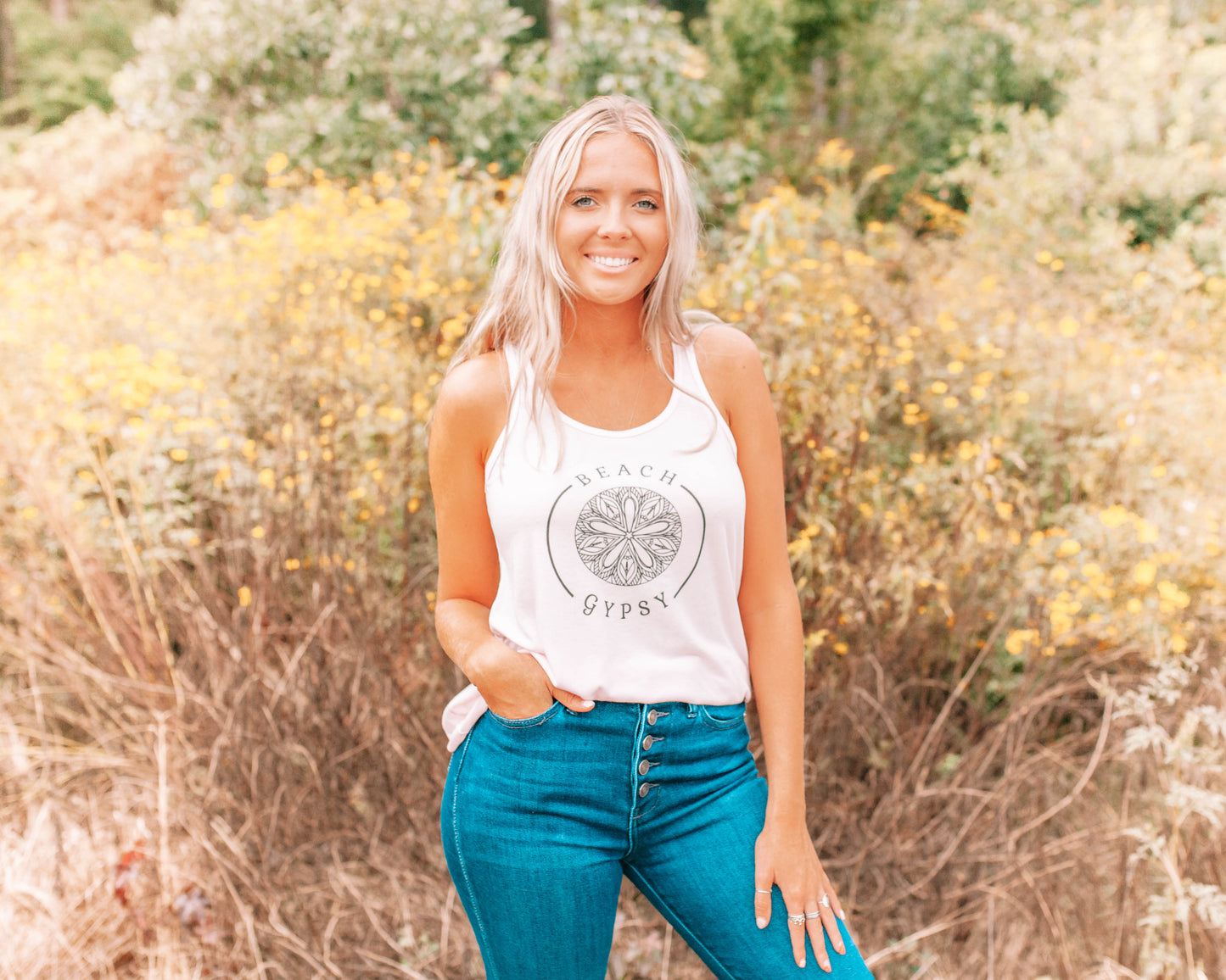 girl wearing pink tank top with black Beach Gypsy logo