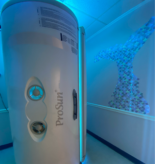 Stand-up UV tanning bed option for unlimited tanning packages at Beach Gypsy Ocean City area in Berlin, MD