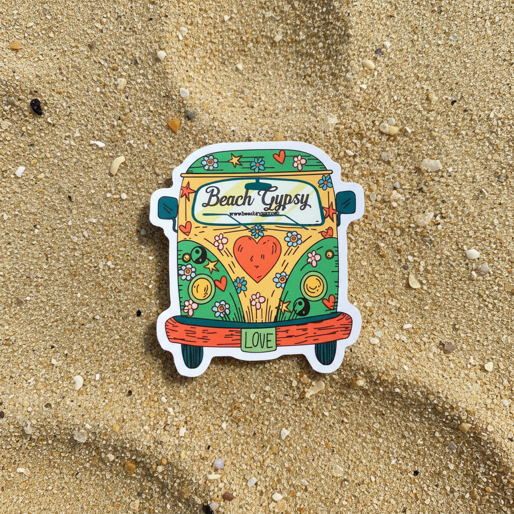 Colorful sticker of a van with 'Beach Gypsy' branding on a sand background