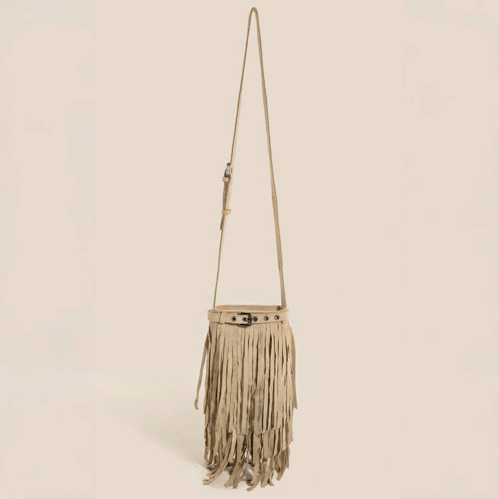 Beige fringe handbag with a strap on a beige background