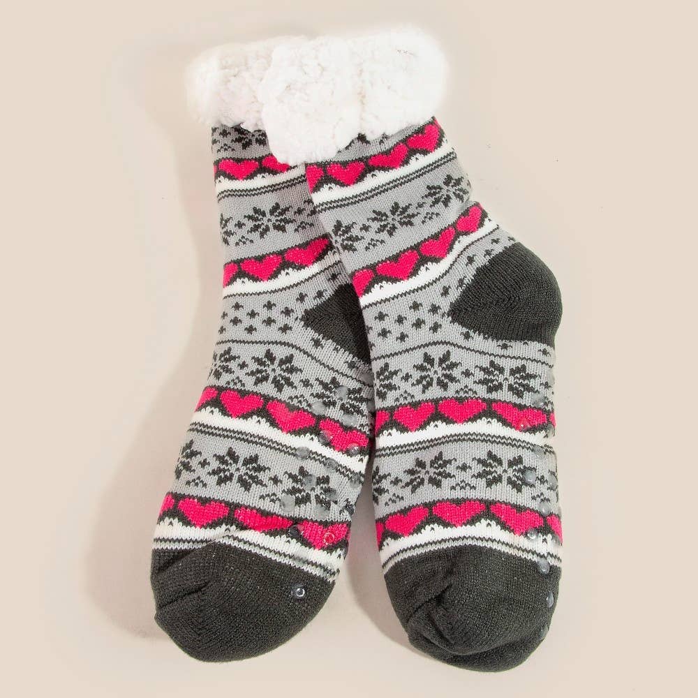 Gray socks with pink heart pattern on a beige background