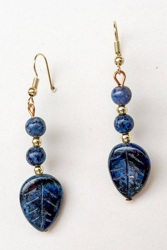 Pair of blue beaded earrings on a white background