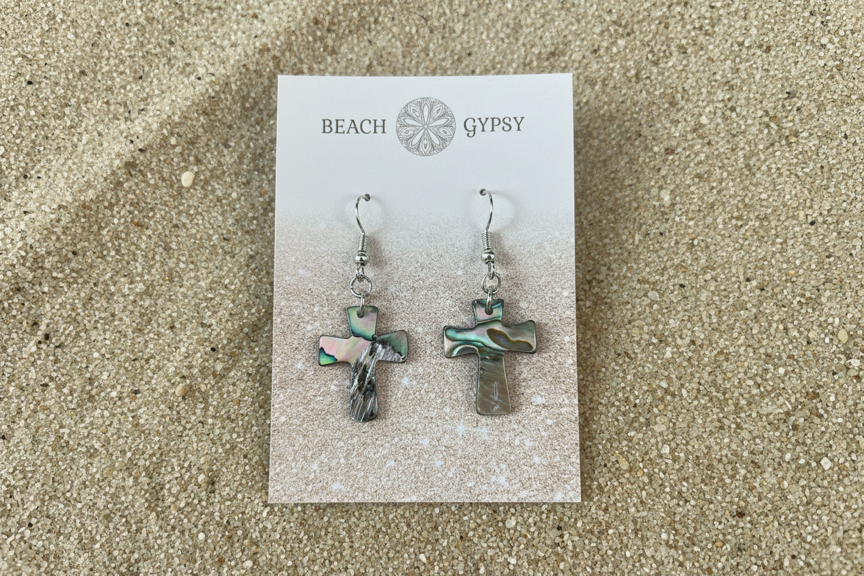 Abalone cross earrings on Beach Gypsy card on sand 