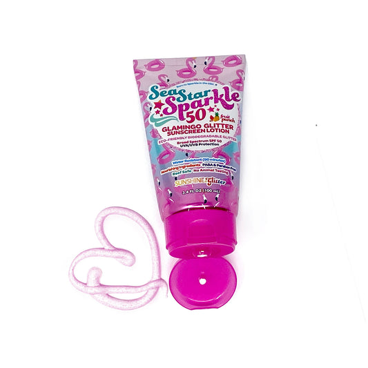 Pink bottle of Sea Star Sparkle sunscreen with a white background