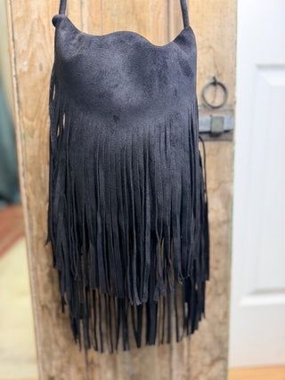 Close-up of black suede-style crossbody bag with layered fringe – Beach Gypsy