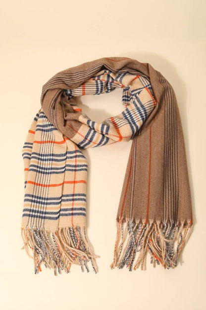 Plaid scarf with brown, beige, and blue pattern on a light background