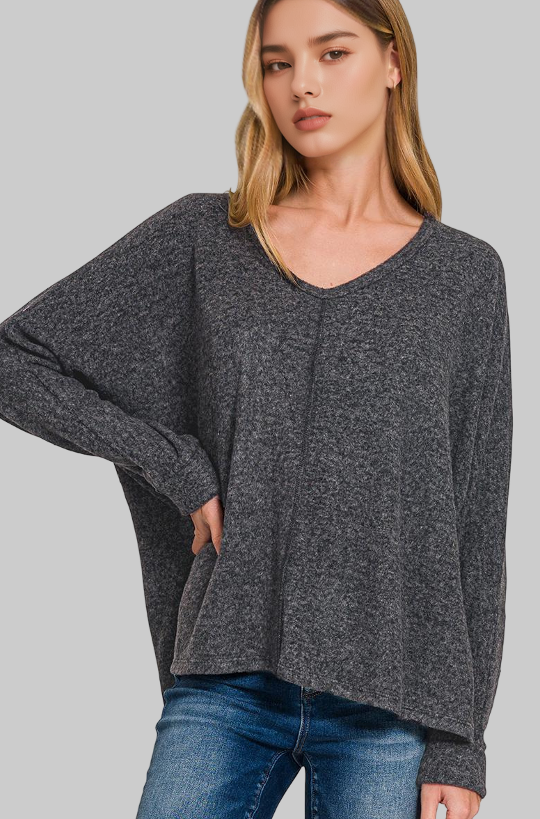 Girl wearing Black soft sweater on white background 