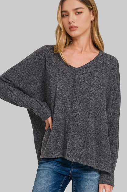 Girl wearing Black soft sweater on white background 