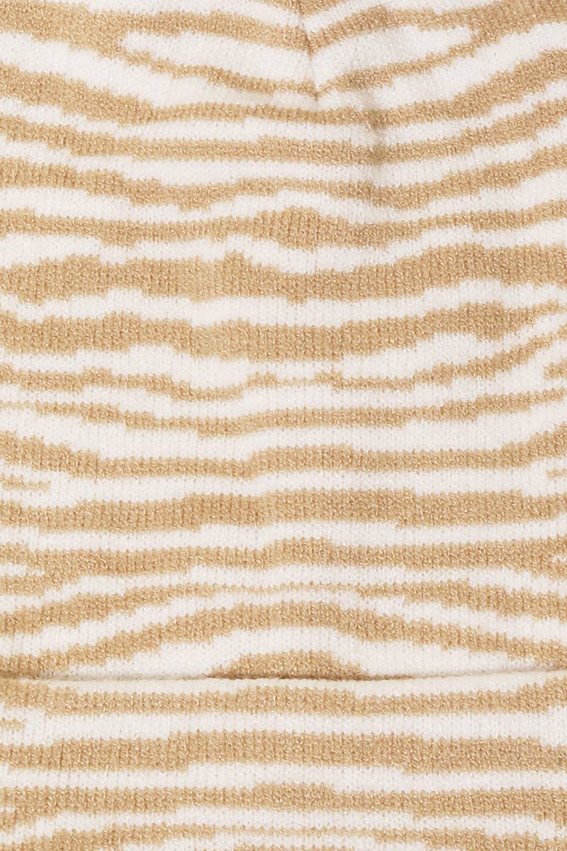 Textured fabric with wavy beige and white pattern