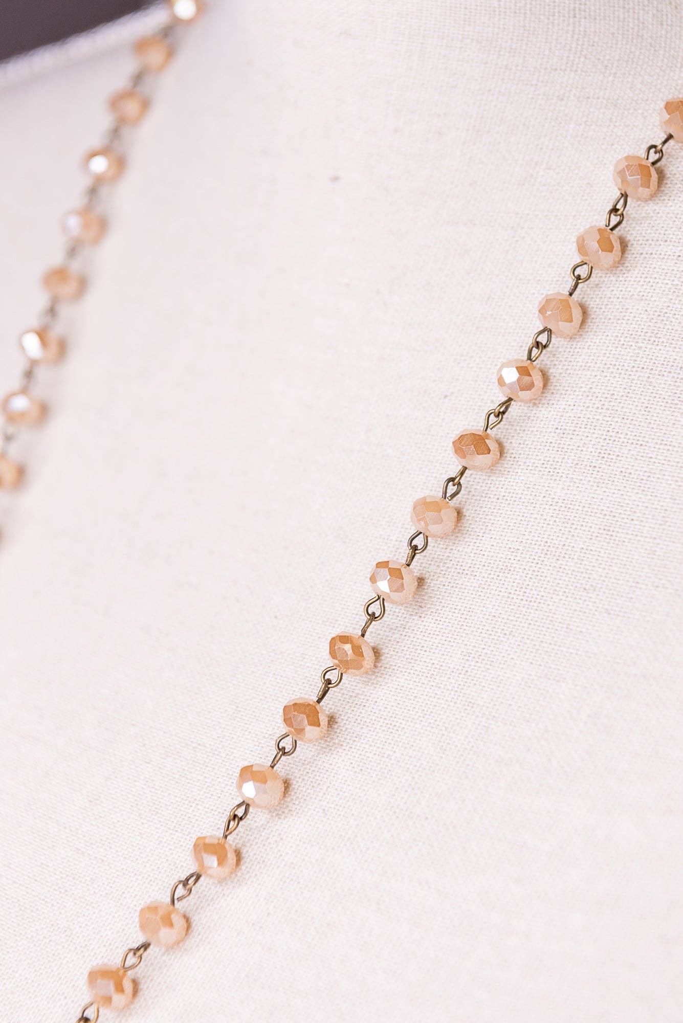 Necklace with pink beads on a white background