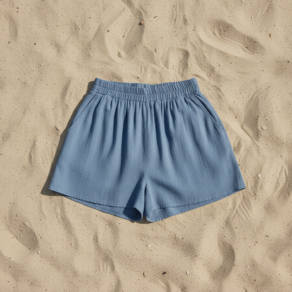 blue pocket shorts laying on sand
