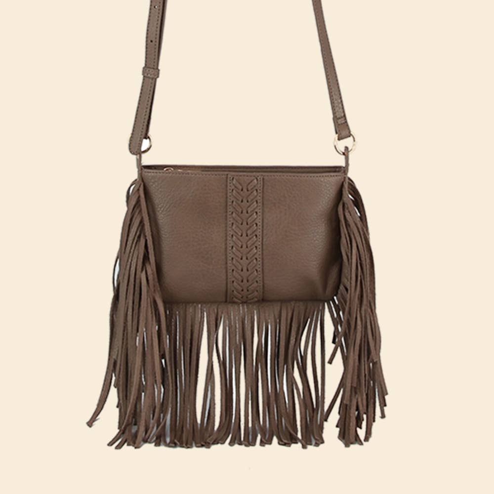 Brown leather handbag with fringe details on a beige background