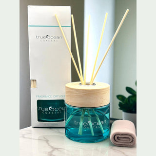 TrueOcean Coastal fragrance diffuser with packaging on a marble surface