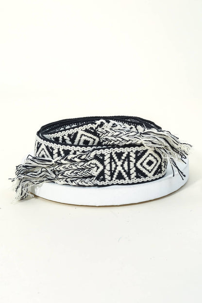 Black and white patterned headband on a white background