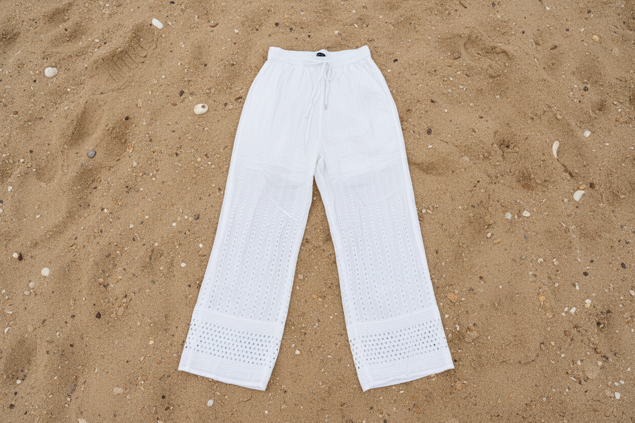 White pants on a sandy surface