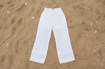 White pants on a sandy surface