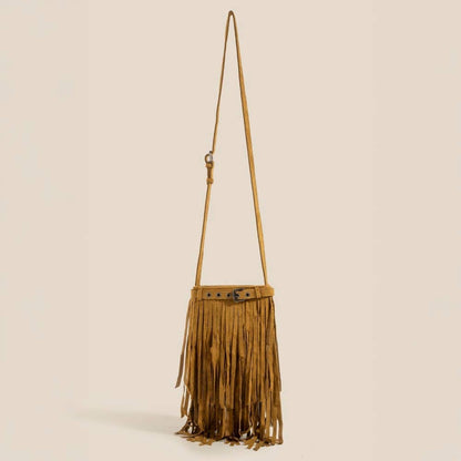 Brown fringe bag with a strap on a beige background