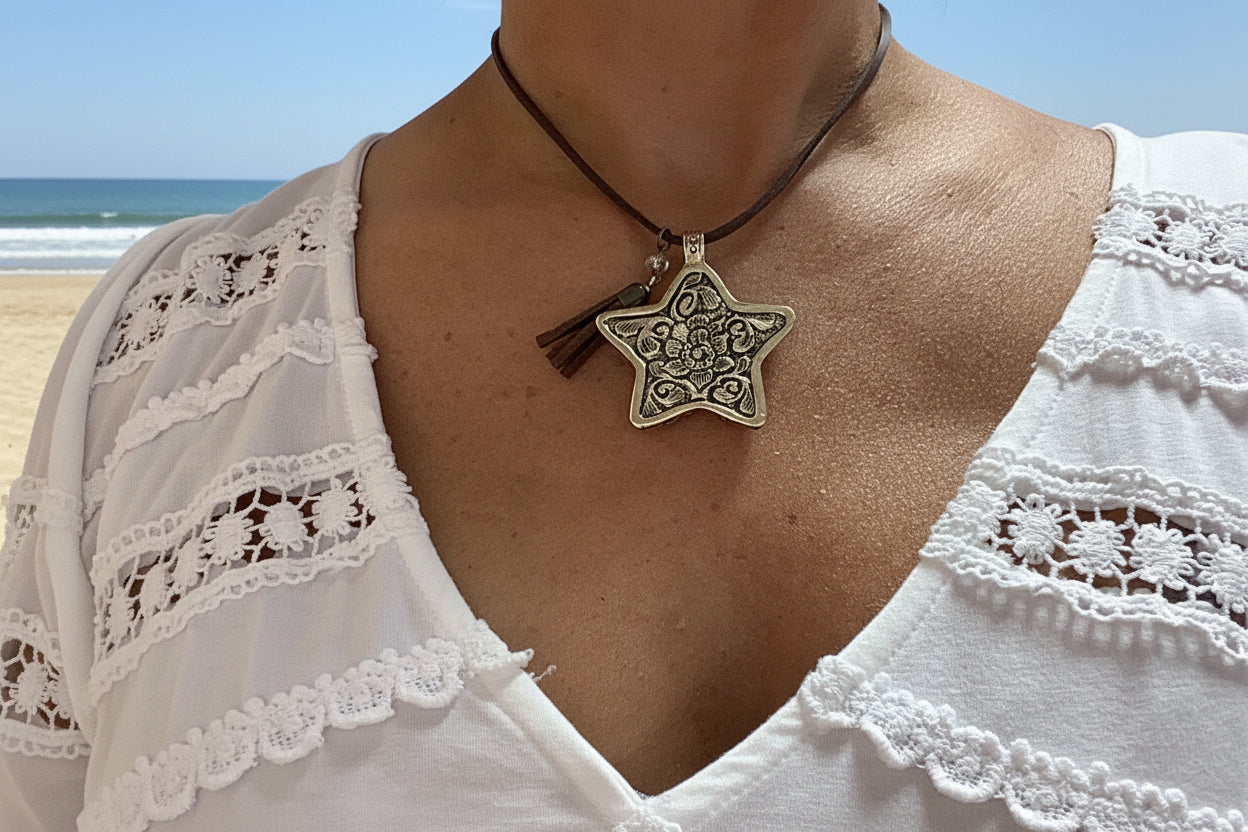 Star pendant on a brown suede cord