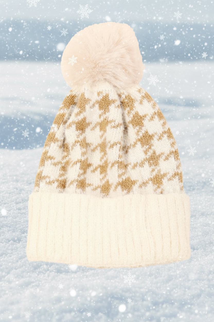Knitted beanie with a houndstooth pattern on a snowy background