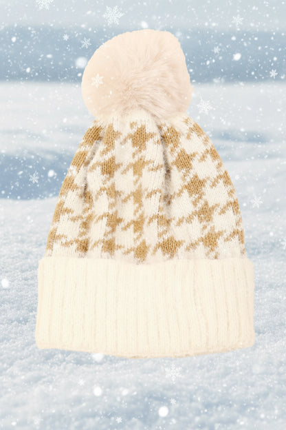 Knitted beanie with a houndstooth pattern on a snowy background