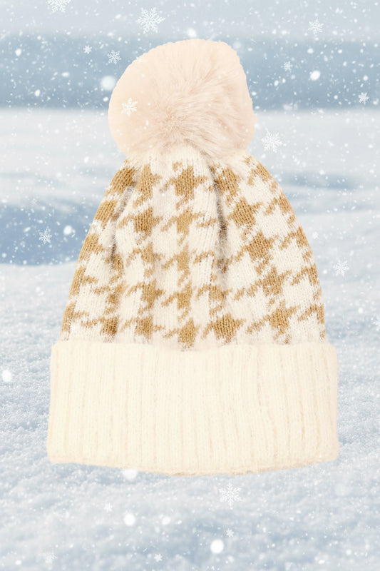 Knitted beanie with a houndstooth pattern on a snowy background