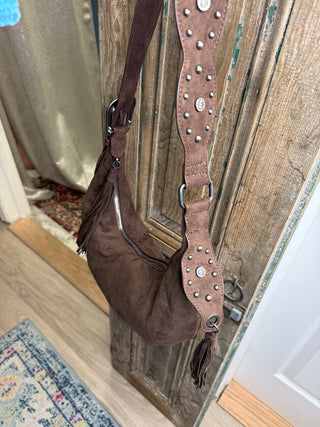 Side view of brown half moon bag showing the studded strap detail and fringe tassel – Beach Gypsy