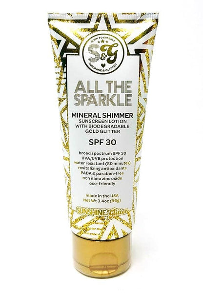 Sunscreen lotion tube with gold and white design on a white background