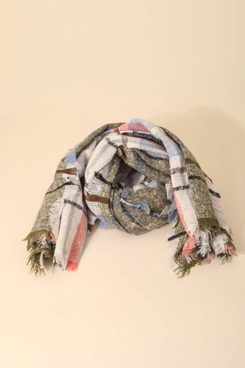 Plaid scarf with tassels on a beige background