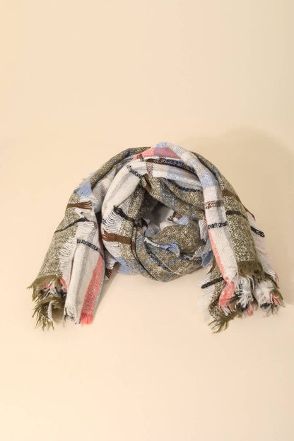 Plaid scarf with tassels on a beige background