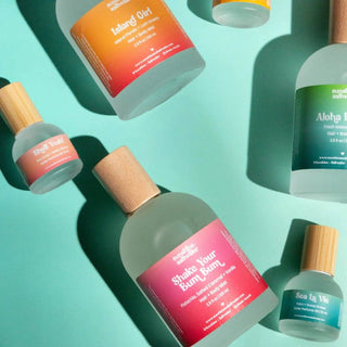 Various bottles with colorful labels on a green background