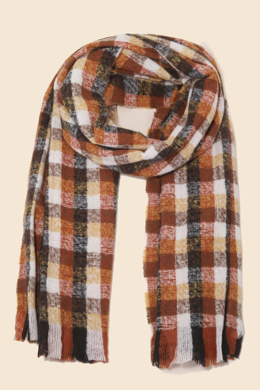 Plaid scarf with autumn colors on a beige background