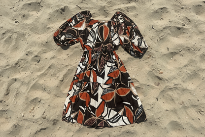 Cocoa Peasant Dress on sandy background 