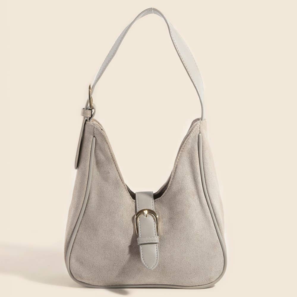 Gray handbag with a buckle on a beige background