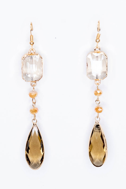 Pair of earrings with clear and brown teardrop-shaped stones on a white background