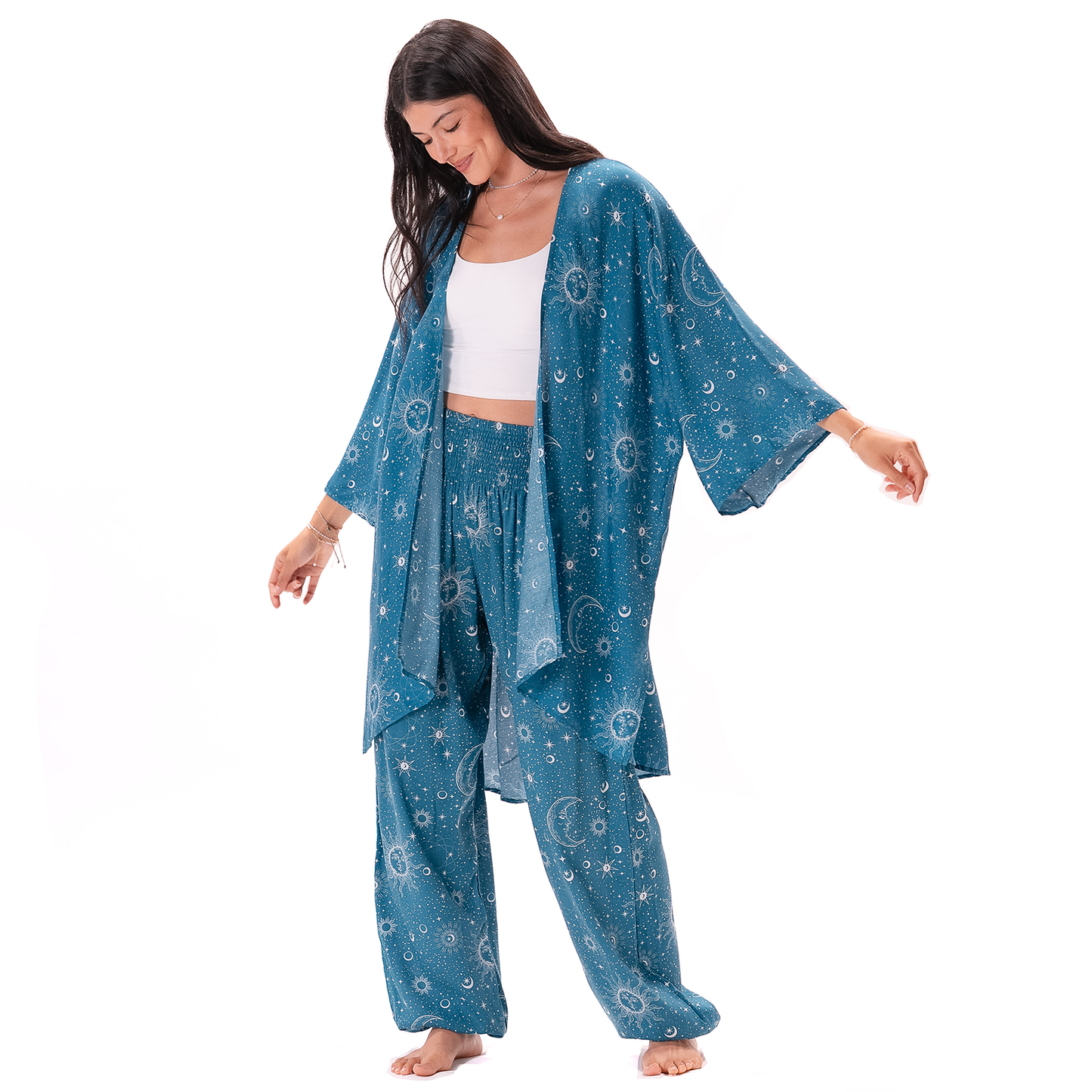 Woman wearing a blue patterned kimono-style outfit on a white background