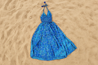 Blue paisley silk halter dress on sandy beach