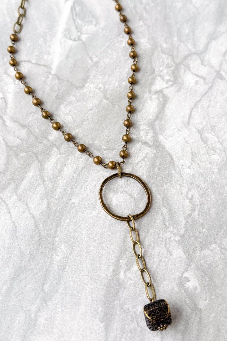 Necklace with a pendant on a textured white background