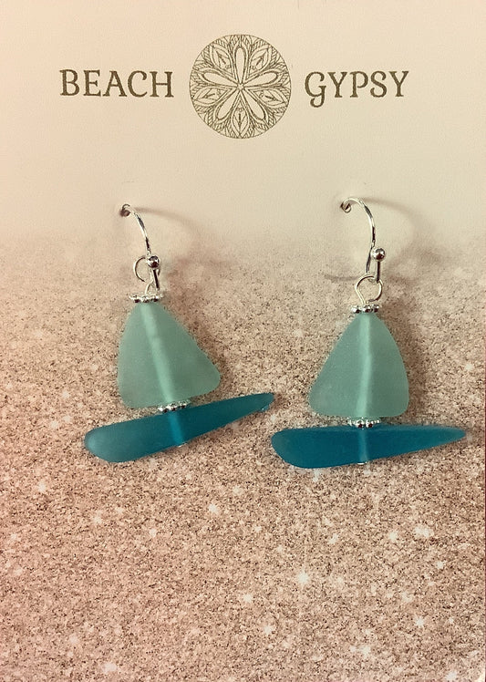 Seaglass sailboat  earrings on a 'Beach Gypsy' branded card against a pink background