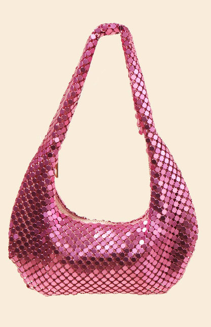 Pink sequin handbag on a beige background