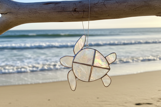 Turtle suncatcher on a branch at beach setting