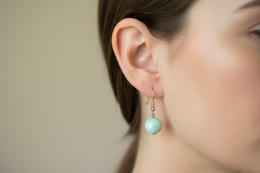 Pair of earrings with Amazonite natural
Stone light green beads on a model